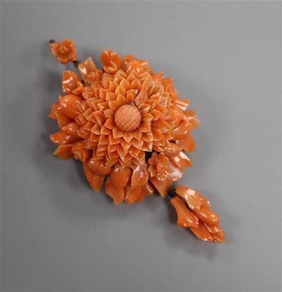 A yellow metal and carved coral flower head drop pendant brooch, overall approx. 8cm.
